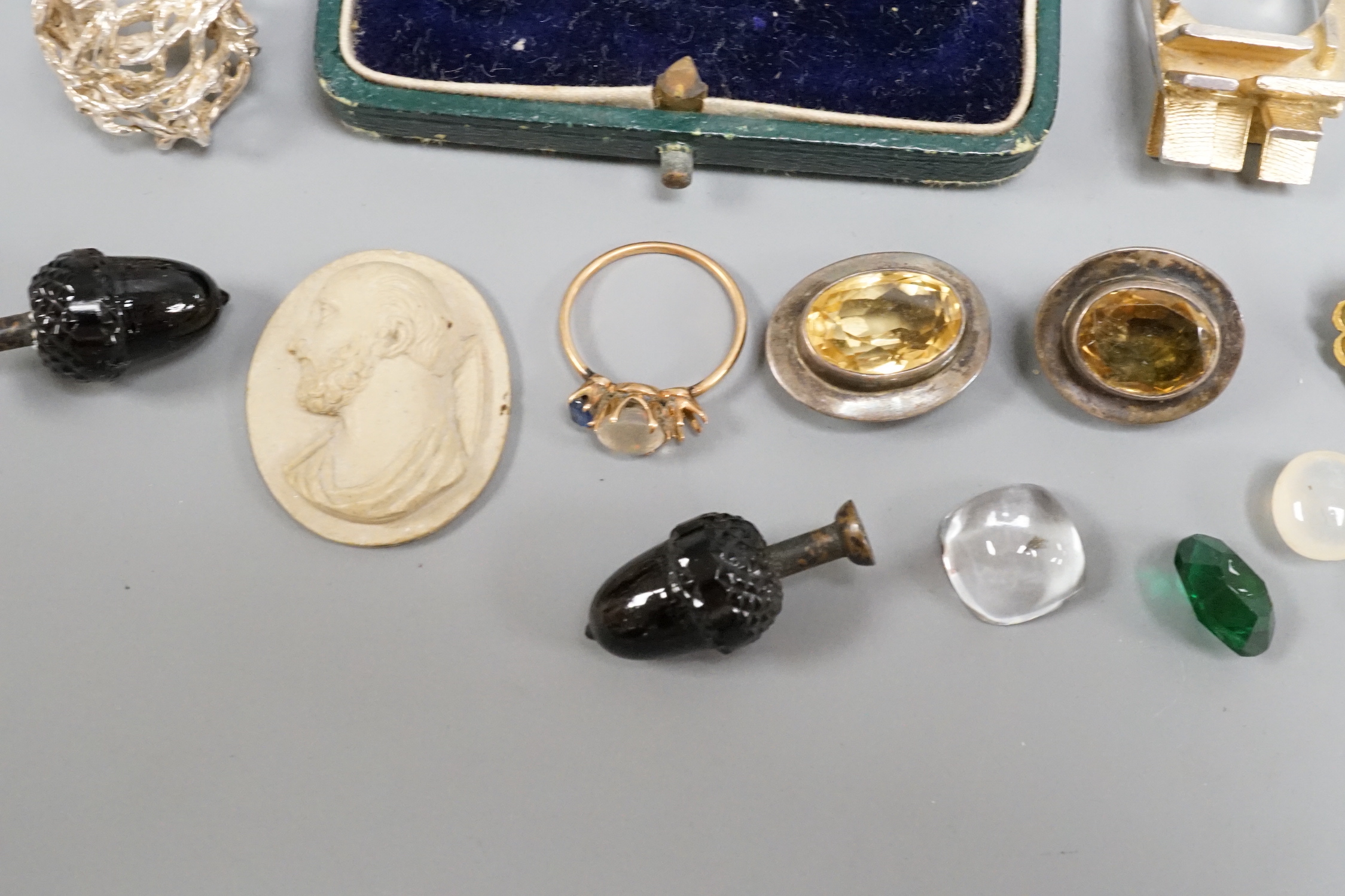 A small group of jewellery and curios including a Scandinavian sterling modernist ring, one other white metal modern ring, a lava cameo dress stud set etc.